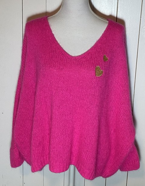 Skøn pink uld strik bluse, med 2 guld hjerter. Str. One Size